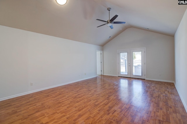 empty room featuring high vaulted ceiling, a ceiling fan, wood finished floors, french doors, and baseboards