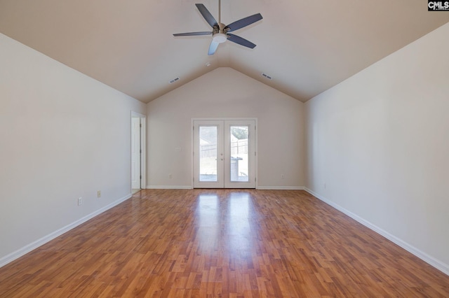 spare room featuring french doors, wood finished floors, visible vents, and ceiling fan