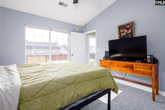 bedroom with visible vents, carpet floors, ceiling fan, and vaulted ceiling