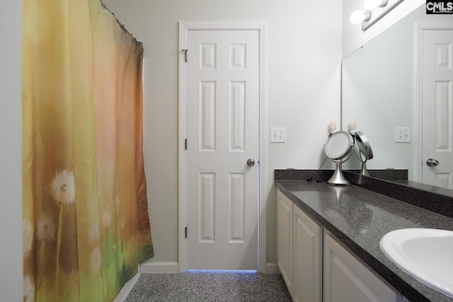 full bathroom with vanity and a shower with shower curtain