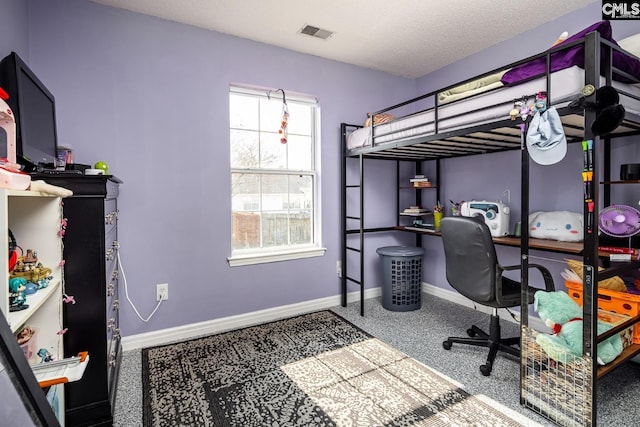 carpeted bedroom with visible vents, a textured ceiling, and baseboards