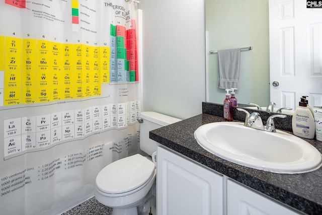 full bathroom with vanity, a shower with shower curtain, and toilet