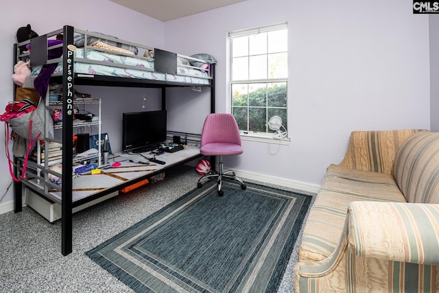 bedroom featuring baseboards