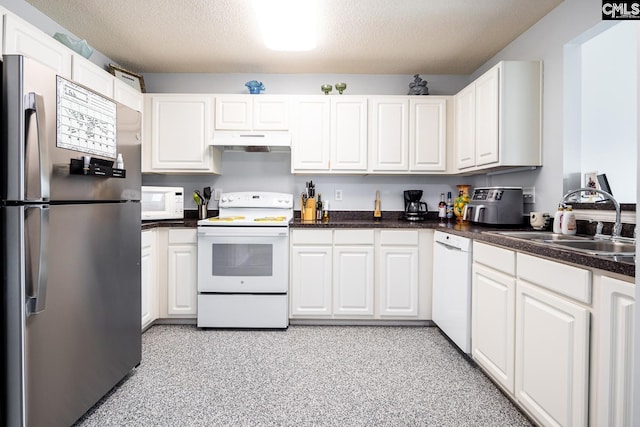 kitchen featuring white appliances, a sink, white cabinets, under cabinet range hood, and a textured ceiling