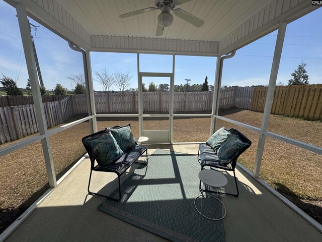 sunroom with a healthy amount of sunlight and a ceiling fan