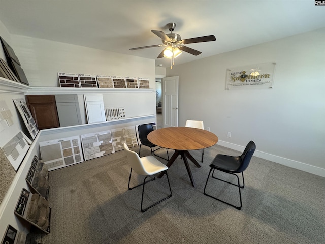 dining space featuring baseboards, carpet, and ceiling fan