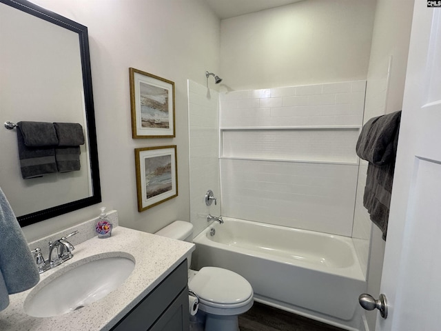 bathroom featuring vanity, toilet, and bathing tub / shower combination