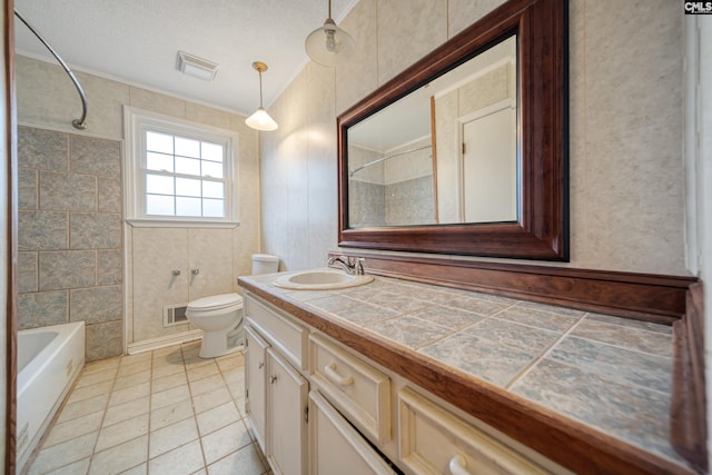 bathroom with tile patterned floors, visible vents, toilet, and vanity