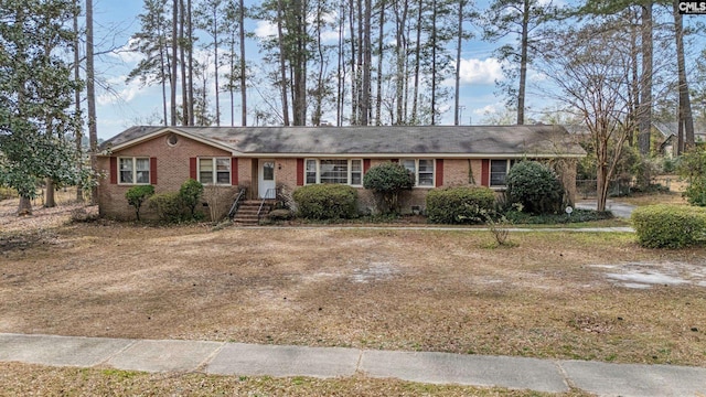 single story home featuring brick siding and crawl space