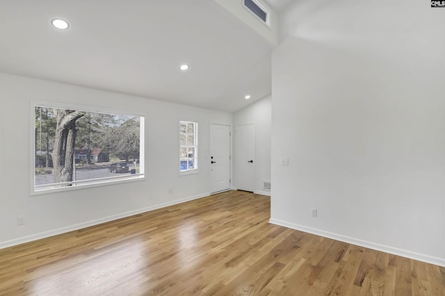 empty room with recessed lighting, visible vents, baseboards, and light wood finished floors