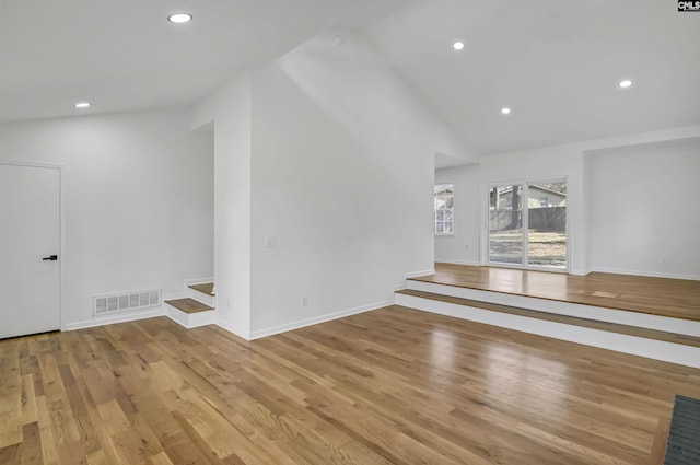 spare room featuring visible vents, recessed lighting, baseboards, and wood finished floors