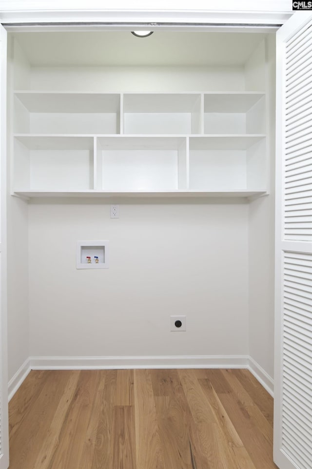 laundry area with washer hookup, laundry area, light wood-style flooring, and electric dryer hookup