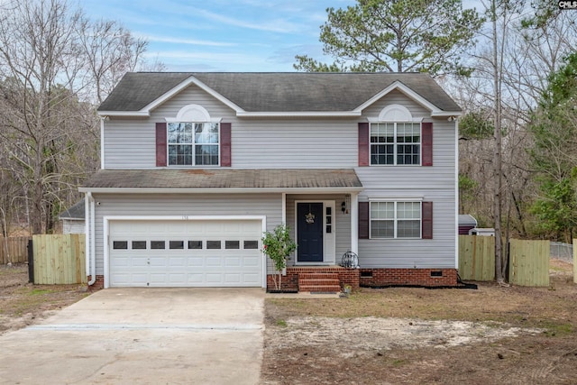 traditional home with fence, a garage, driveway, and crawl space