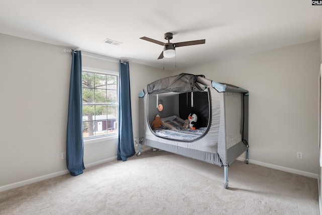 bedroom with visible vents, ceiling fan, baseboards, and carpet floors