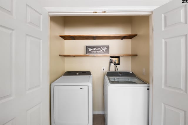 washroom with washer and dryer and laundry area