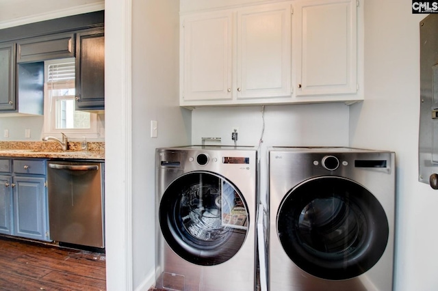 laundry area with a sink, dark wood-type flooring, laundry area, and washer and clothes dryer