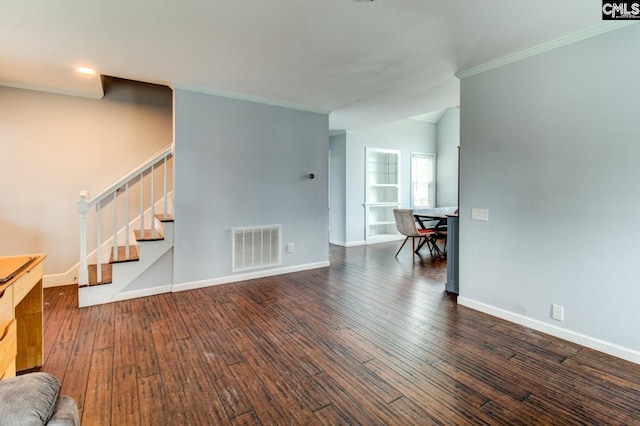 unfurnished living room with baseboards, visible vents, ornamental molding, stairs, and hardwood / wood-style flooring