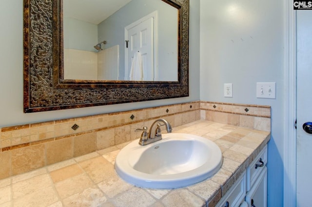 full bath featuring vanity and walk in shower