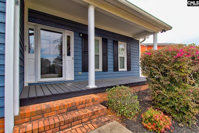 view of property exterior with a porch