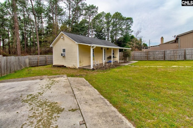 exterior space featuring a patio, a lawn, and a fenced backyard