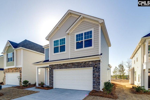 view of front facade with stone siding, board and batten siding, concrete driveway, and an attached garage