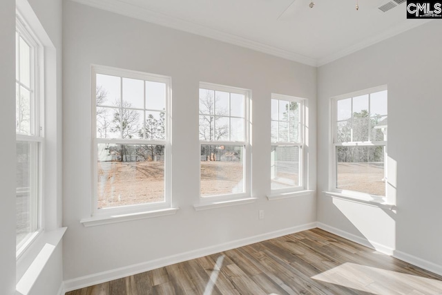 unfurnished sunroom featuring visible vents