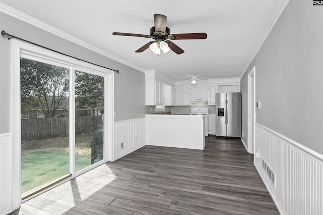 unfurnished living room featuring a textured ceiling, crown molding, dark wood-style floors, and ceiling fan