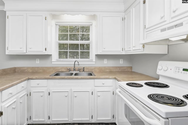 kitchen with under cabinet range hood, white electric stove, white cabinetry, and a sink