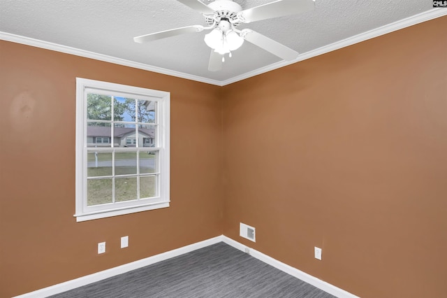 spare room with visible vents, crown molding, baseboards, a textured ceiling, and a ceiling fan