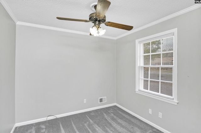 spare room with visible vents, crown molding, ceiling fan, baseboards, and dark colored carpet