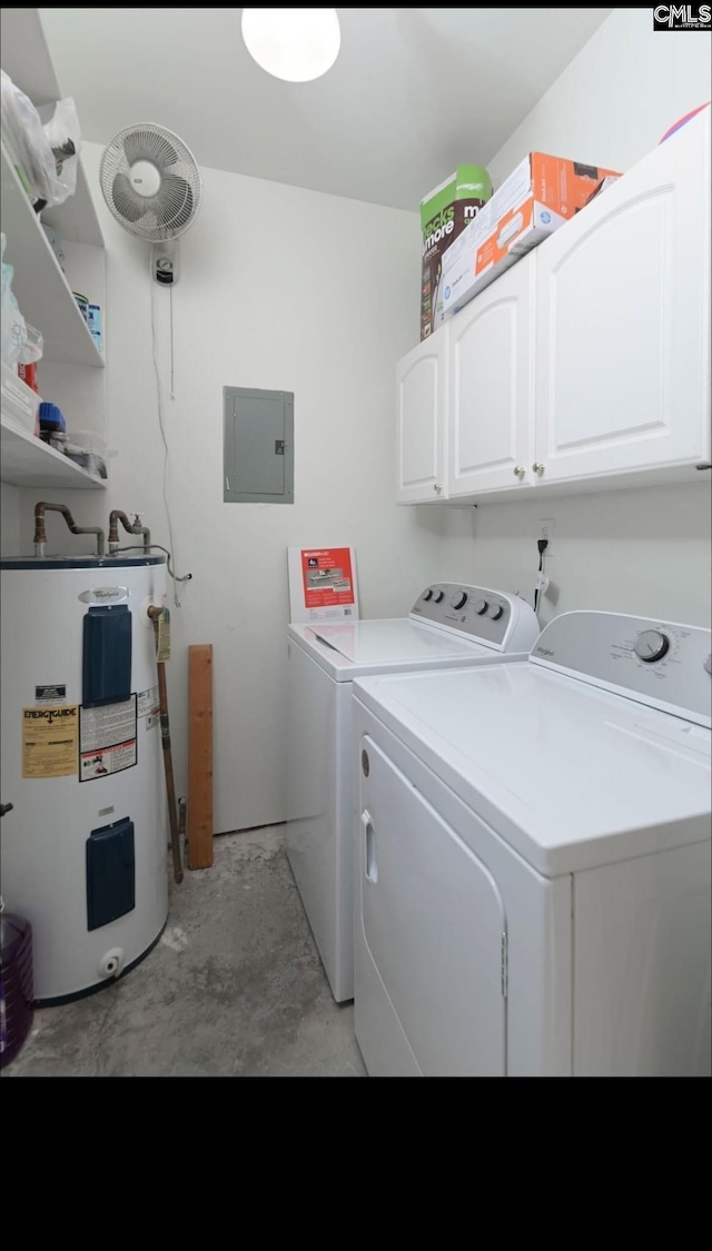 laundry area featuring washing machine and clothes dryer, electric panel, cabinet space, and electric water heater