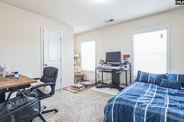 carpeted bedroom with visible vents