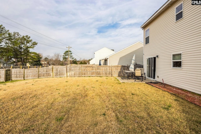 view of yard with a patio and fence