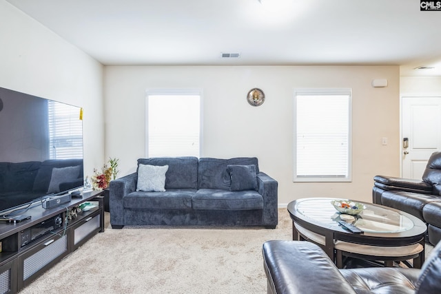 living room featuring carpet and visible vents