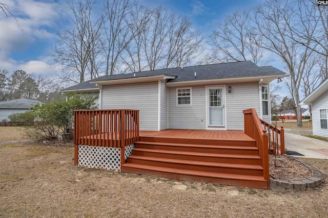 back of property featuring a deck