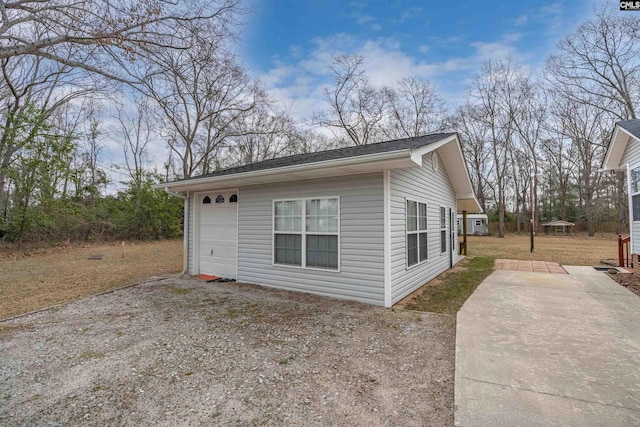 exterior space with a garage and driveway