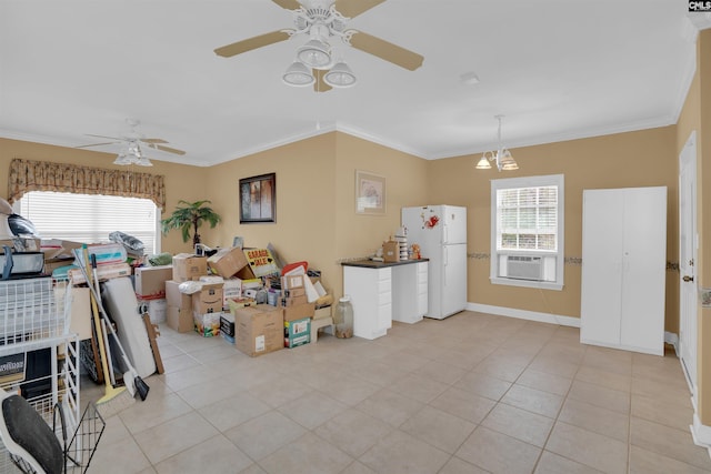 kitchen with crown molding, freestanding refrigerator, and ceiling fan