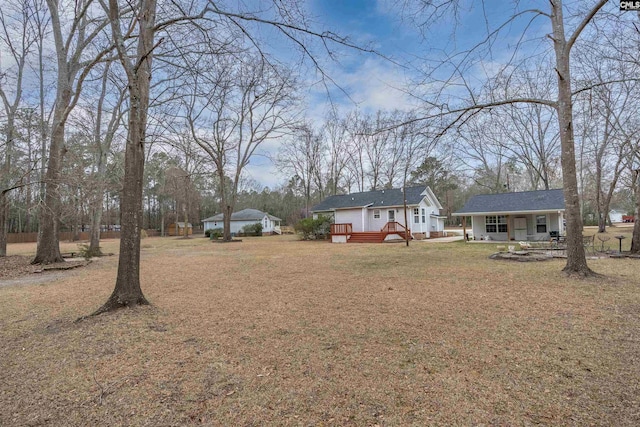 view of yard featuring a wooden deck