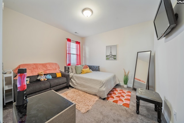 bedroom featuring visible vents, baseboards, and carpet flooring