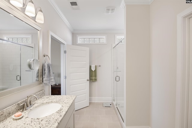 bathroom featuring vanity, baseboards, visible vents, a shower stall, and crown molding