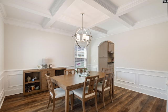 dining area with an inviting chandelier, beam ceiling, dark wood-style floors, and arched walkways