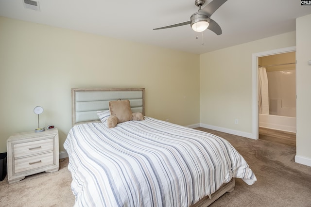 carpeted bedroom with visible vents, a ceiling fan, and baseboards