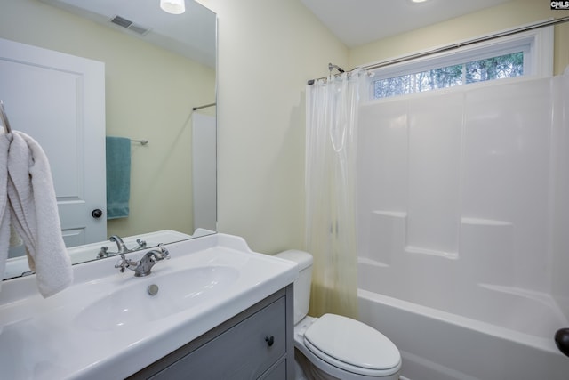 full bath featuring visible vents, toilet, shower / bath combo, and vanity