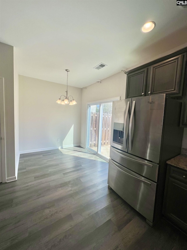 kitchen featuring wood finished floors, baseboards, visible vents, stainless steel refrigerator with ice dispenser, and a chandelier