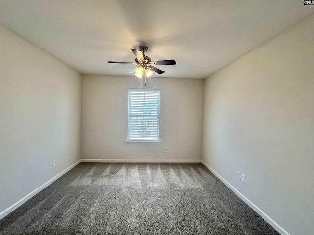 unfurnished room with baseboards, carpet, and a ceiling fan