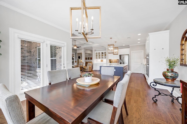 dining area featuring recessed lighting, ceiling fan with notable chandelier, ornamental molding, and wood finished floors