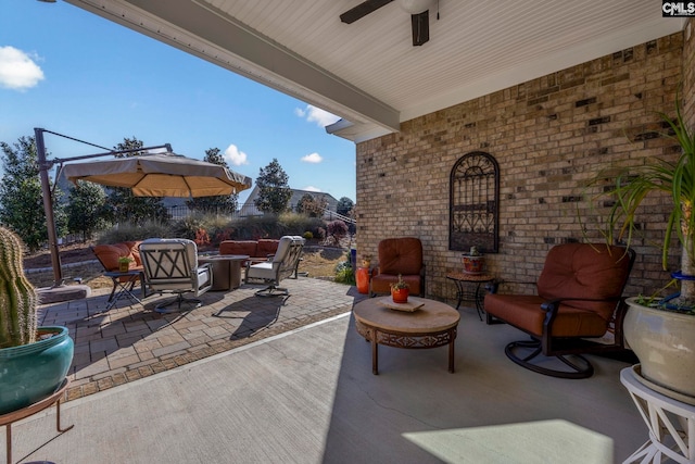 view of patio / terrace featuring an outdoor living space and ceiling fan