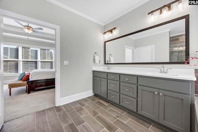 full bath featuring a sink, baseboards, ceiling fan, and ornamental molding