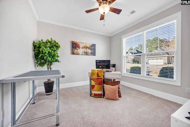 carpeted office space featuring ceiling fan, baseboards, and ornamental molding