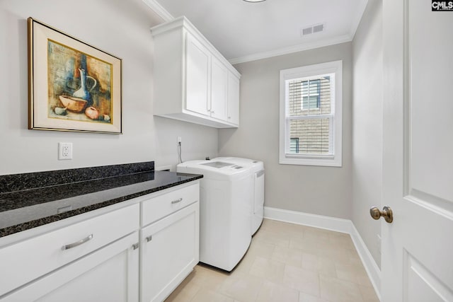 laundry room with visible vents, crown molding, baseboards, cabinet space, and separate washer and dryer